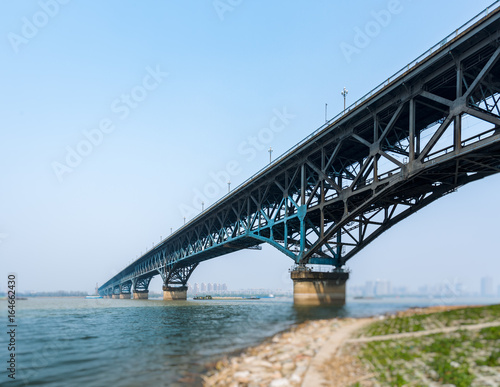 Long bridge across river in city of China. © fanjianhua
