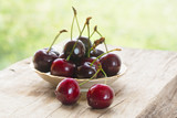 Sweet cherry berries on a wooden table.