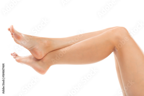 Beautiful women feet isolated on white close-up