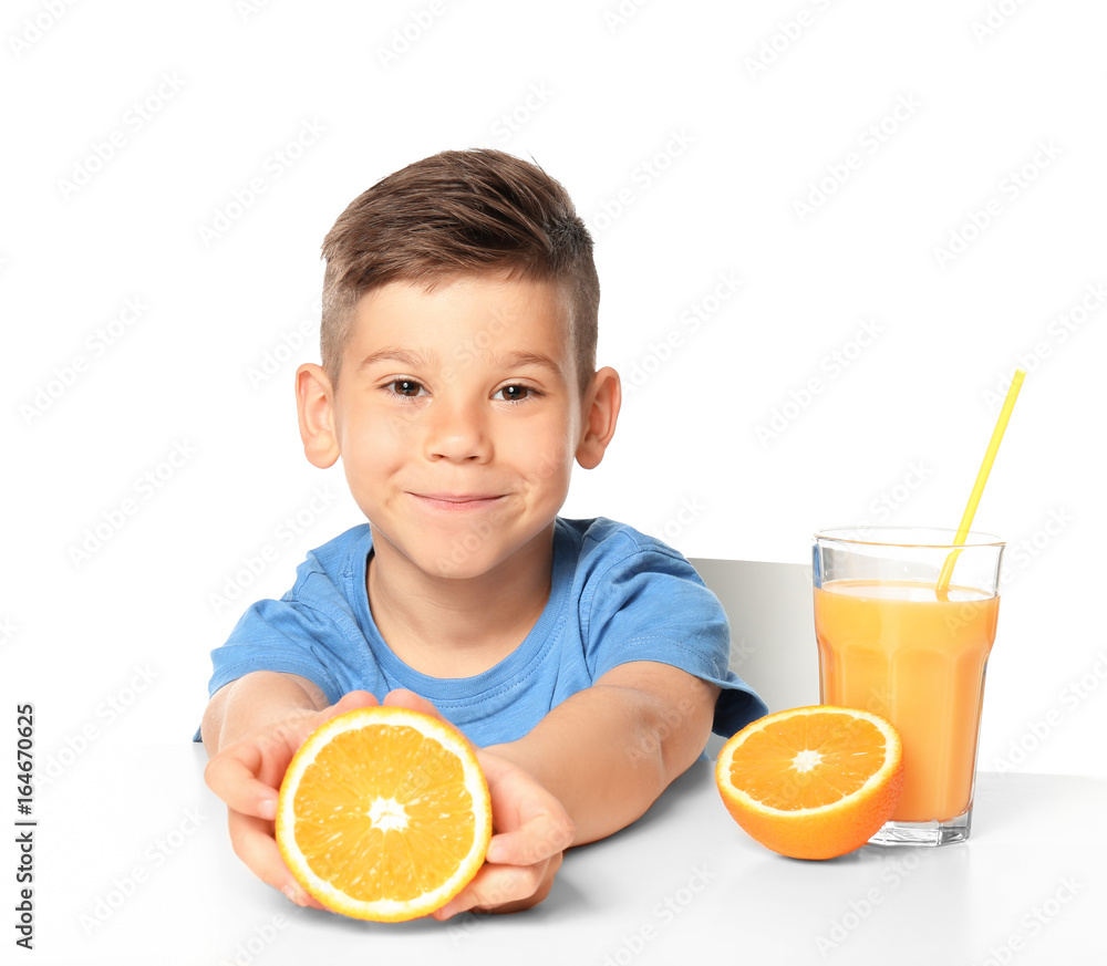 Cute little boy with juice and orange fruit on white background Cute little boy with juice and orange fruit on white background
