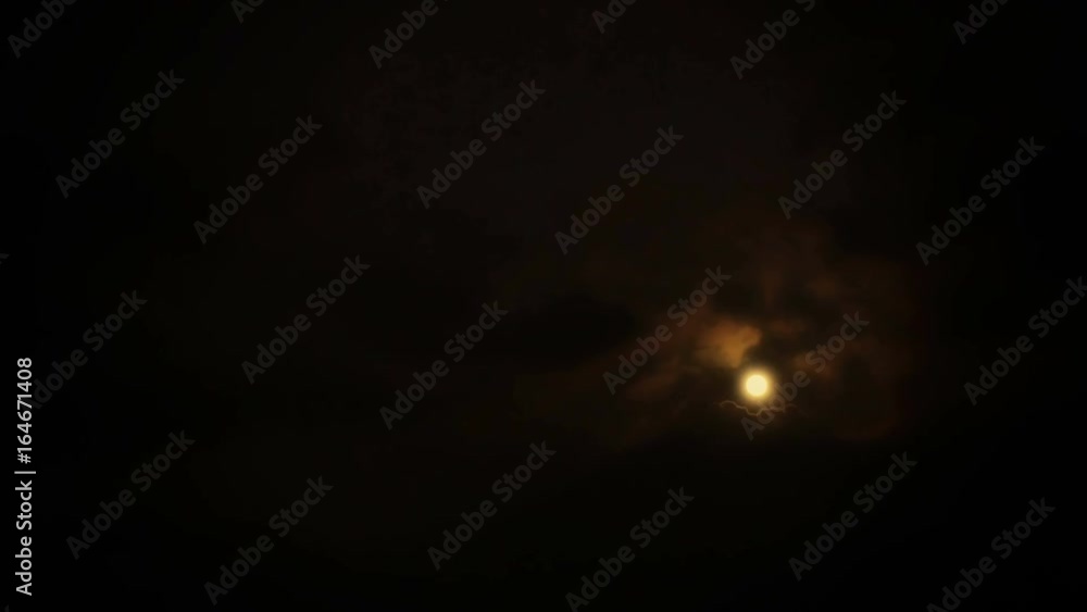Wide angle view of a cloudy night sky framing a full moon. Wide angle view of a cloudy night sky framing a full moon.