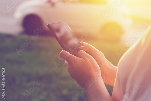 Wallpaper Mural Woman using mobile phone app to call taxi cab Torontodigital.ca