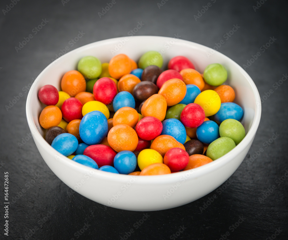 Cocolate coated Peanuts on a slate slab (selective focus) Cocolate coated Peanuts on a slate slab (selective focus)