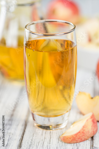 Apple Cider on wooden background (selective focus)