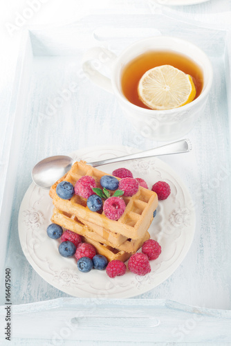 Waffles with berries and te...