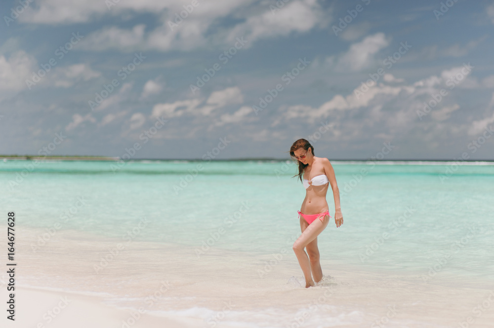 Beautiful girl on the beach on the island
