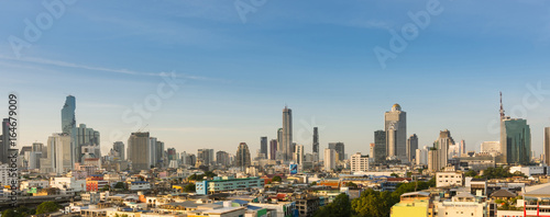 Panorama of cityscape buildings and skyscrapers of downtown luxury hotel with blue sky in bangkok thailand.