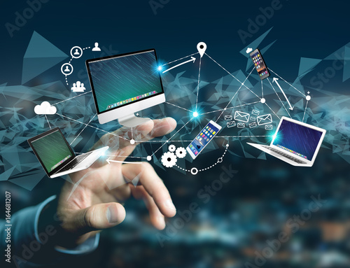 Computer and devices displayed on a futuristic interface with interantional network - Multimedia and technology concept photo