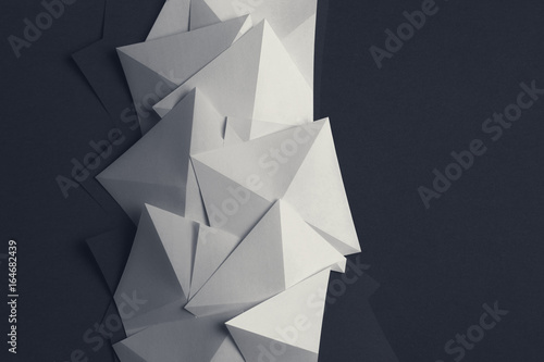 Geometric shapes of white paper, background