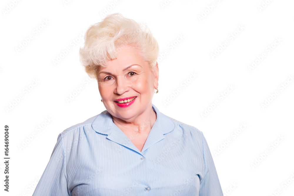 Elderly woman smiling on a white background, space for text Elderly woman smiling on a white background, space for text