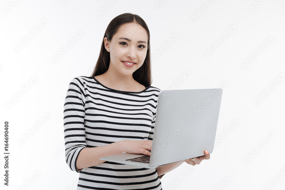 Attractive brunette working with her computer Attractive brunette working with her computer