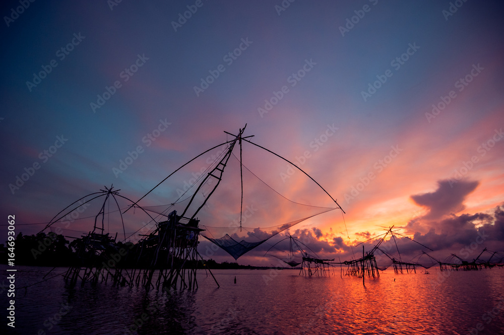 Beautiful landscape of sunrise and Yor building is traditional local fisherman used net fishing in Pakpra Thale Noi,  Phatthalung, South of THAILAND.