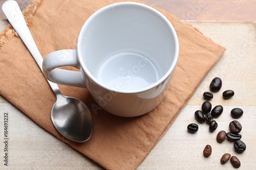 empty white coffee cup on wood background