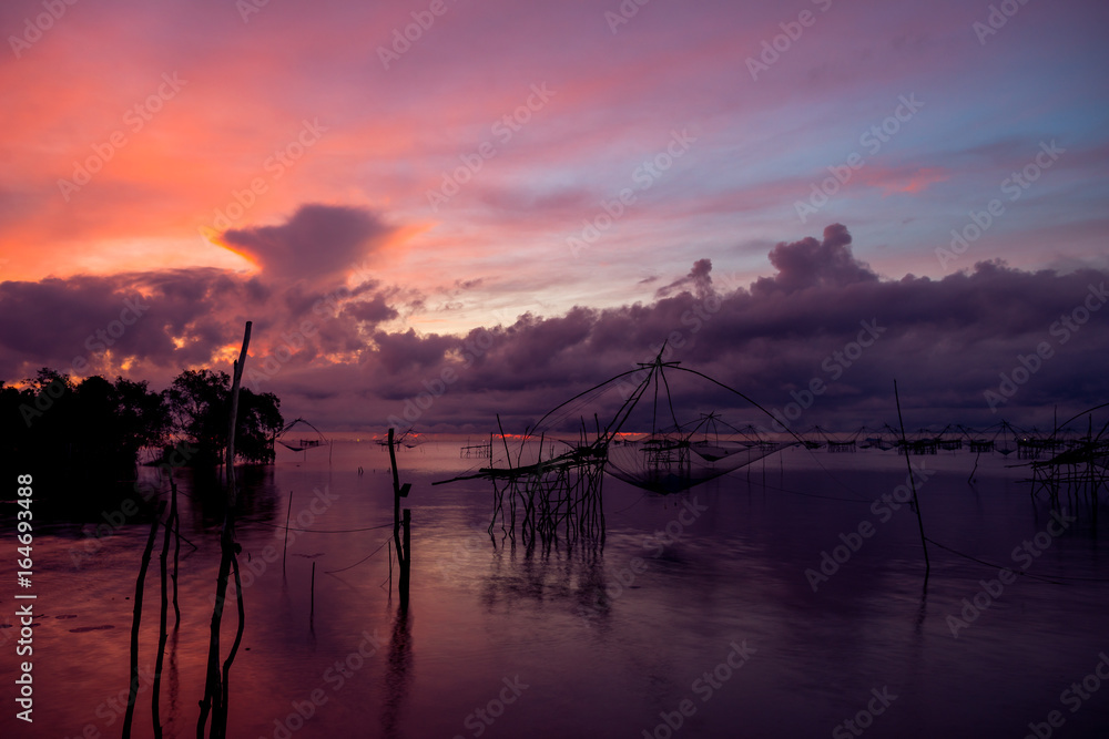 Beautiful landscape of sunrise and Yor building is traditional local fisherman used net fishing in Pakpra Thale Noi,  Phatthalung, South of THAILAND.