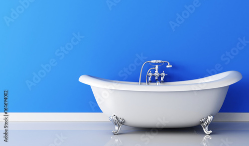Bathtub and faucet and blue wall photo