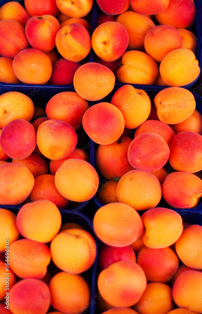 Apricot Background - Fresh organic Cherry fruits. Frame composition of fruits on market stall close up. Apricot Background - Fresh organic Cherry fruits. Frame composition of fruits on market stall close up.