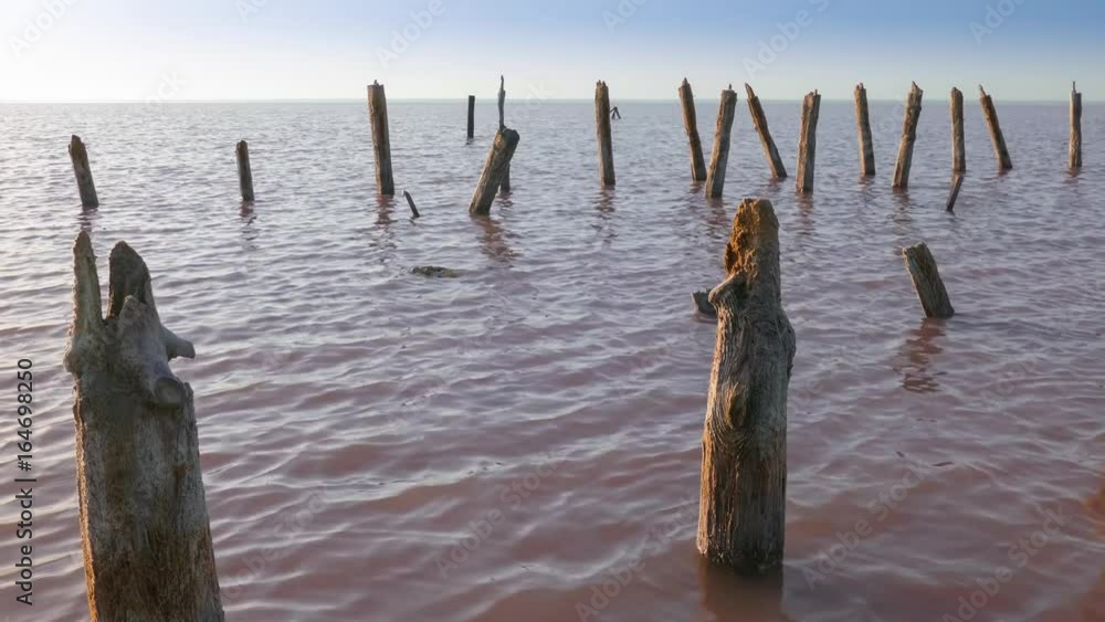 Ruined wooden pier on lake / Ruined wooden pier on lake in early morning Ruined wooden pier on lake / Ruined wooden pier on lake in early morning