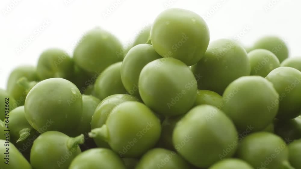 Fresh green peas rotate. Counterclockwise rotation . Close up Fresh green peas rotate. Counterclockwise rotation . Close up