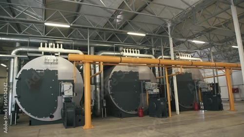 Wallpaper Mural Three large gas boilers in an automated boiler house. Interior industrial with a lot of piping, pumps and valves. Modern boiler room equipment for heating system. Pipelines, water pump Torontodigital.ca