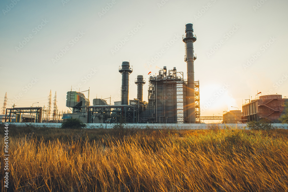 Petrochemical plant in silhouette image at sunset,Glow light of petrochemical industry on sunset and Twilight sky ,Power plant,Energy power station area