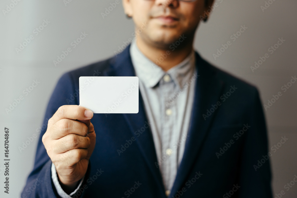 Man holding white business card,Man wearing blue shirt and showing blank white business card. Blurred background. Horizontal mockup, Smart asian business Person Professional Occupation cheerful Man holding white business card,Man wearing blue shirt and showing blank white business card. Blurred background. Horizontal mockup, Smart asian business Person Professional Occupation cheerful