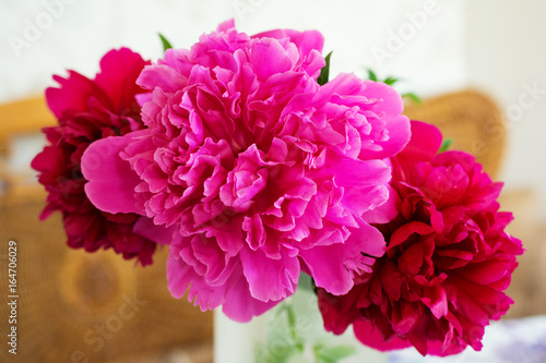 Bouquet of flowers of a peony burgundy and pink.