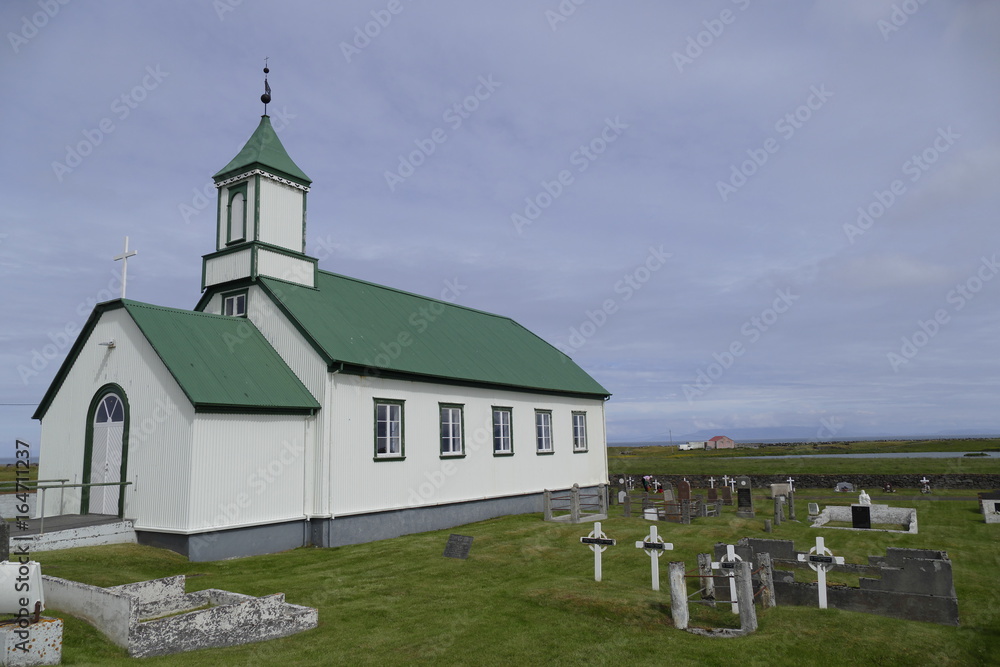 church with green roof at gardur iceland