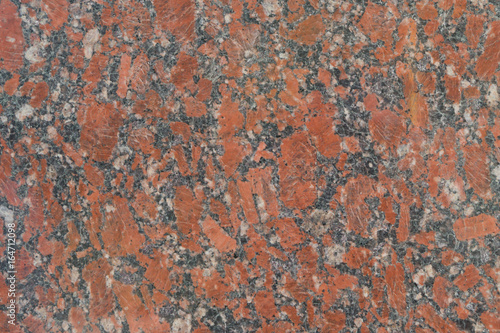 Pattern of red granite, closeup. Background, textured.
