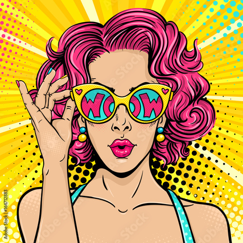 Wow pop art face. Sexy surprised woman with pink curly hair and open mouth holding sunglasses in her hand with inscription wow in reflection. Vector colorful background in pop art retro comic style.