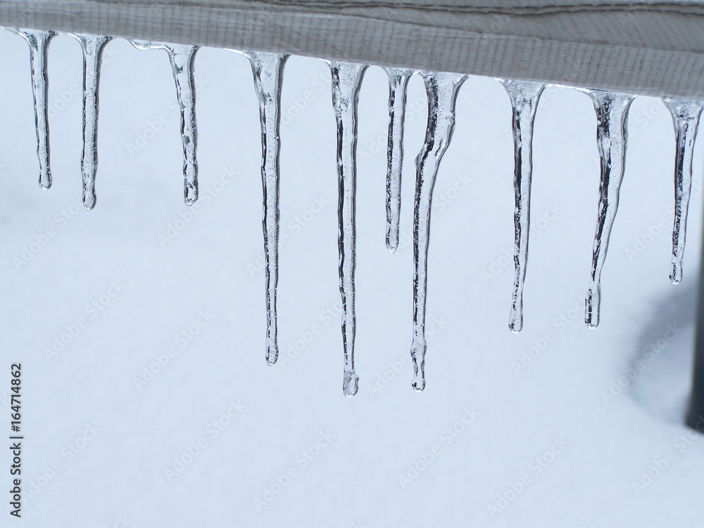Close-Up Of Icicles On Railing
