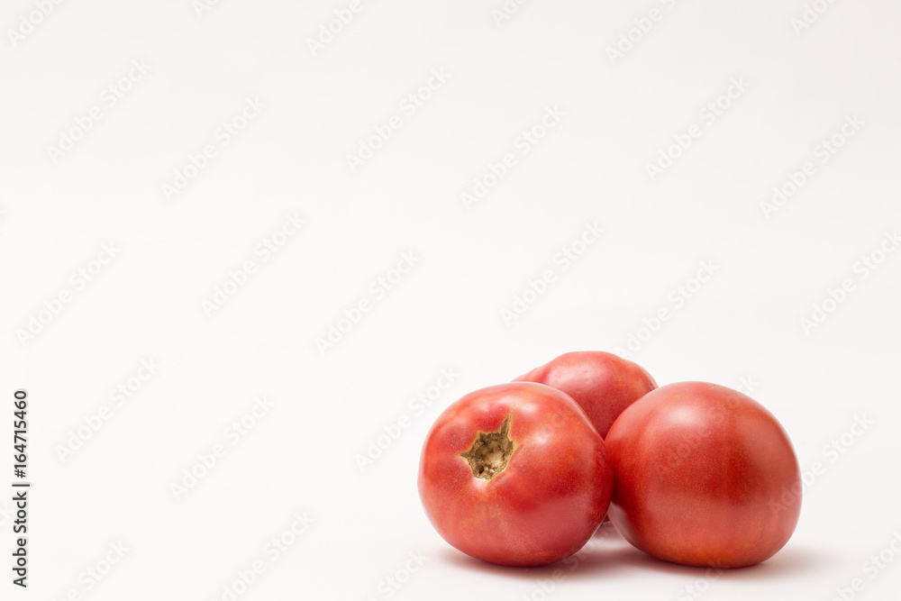 fresh tomatos isolated on white background fresh tomatos isolated on white background