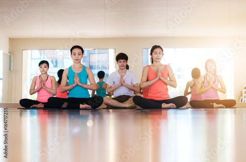 Young woman practicing yoga indoors.Yoga Practice Exercise Class Concept © saksit