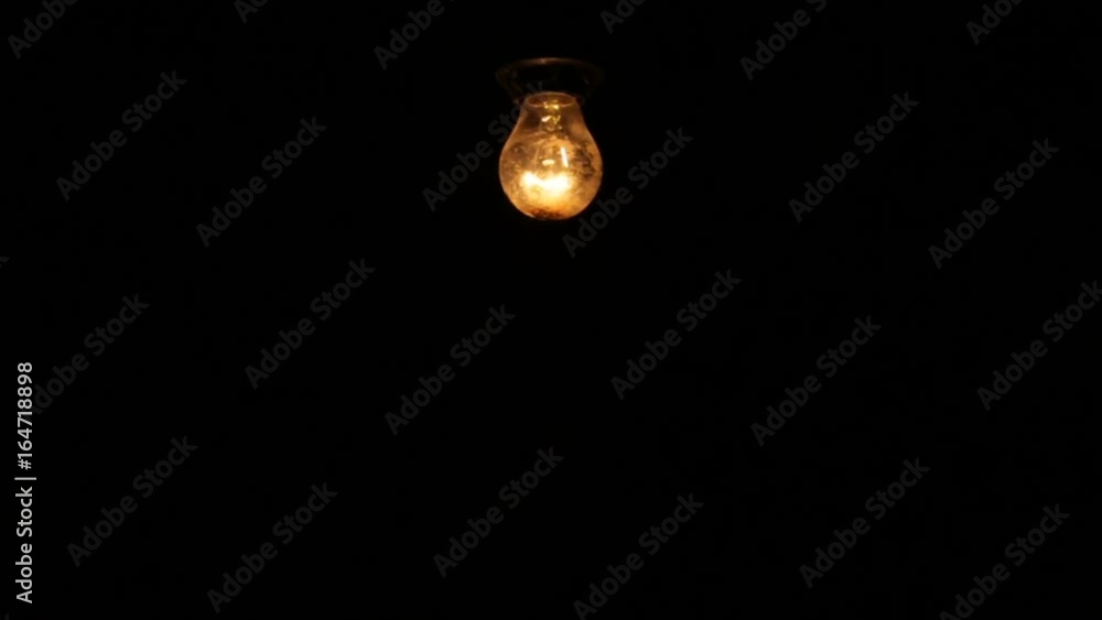 Electric light bulb on a black background Electric light bulb on a black background