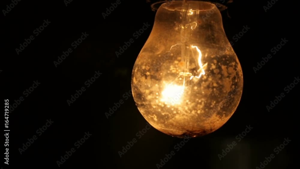 Electric light bulb on a black background Electric light bulb on a black background