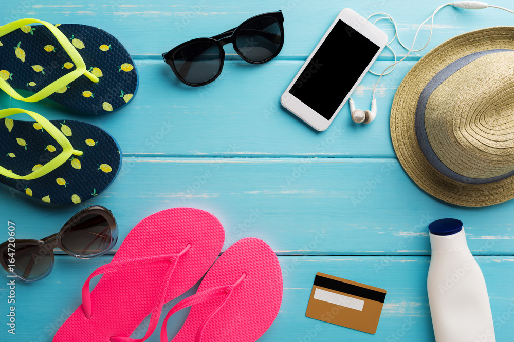 Naklejka Vacation background on blue wood, online shopping on smartphone