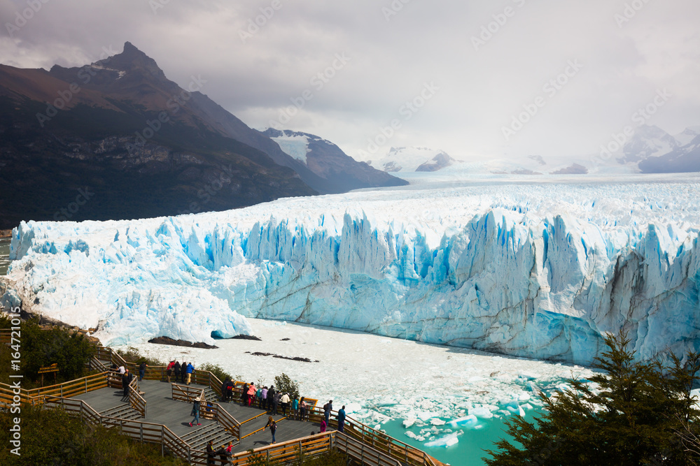 Tourists on observation deck of glacier Perito Moreno