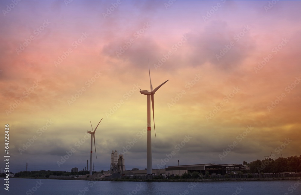 Wind Turbines . Beautiful sky of a decline . Wind turbine and sky  .Cityscape Sunset . 