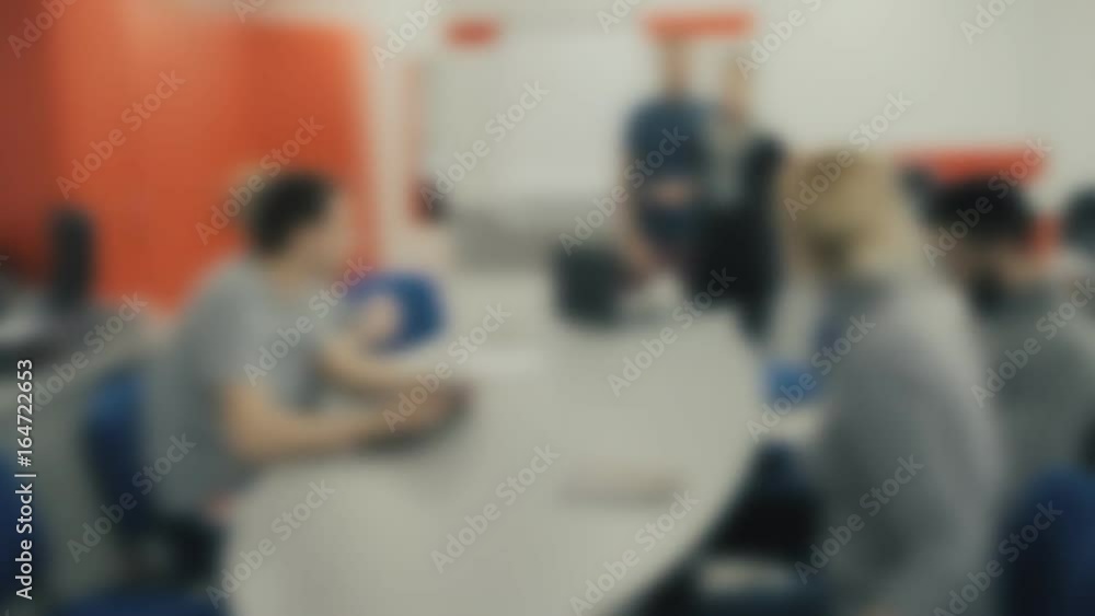Abstract Blurred Background of Young Business People on a Meeting in a Conference Room. Abstract Blurred Background of Young Business People on a Meeting in a Conference Room.