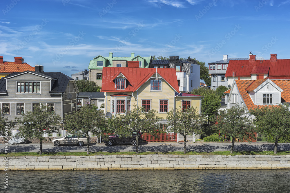 Row of ancient colorful wooden houses in the city of Karlskrona, Sweden Row of ancient colorful wooden houses in the city of Karlskrona, Sweden