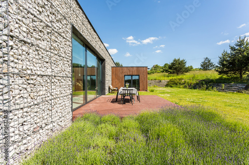 Pebble wall house with modern architecture tarrace photo