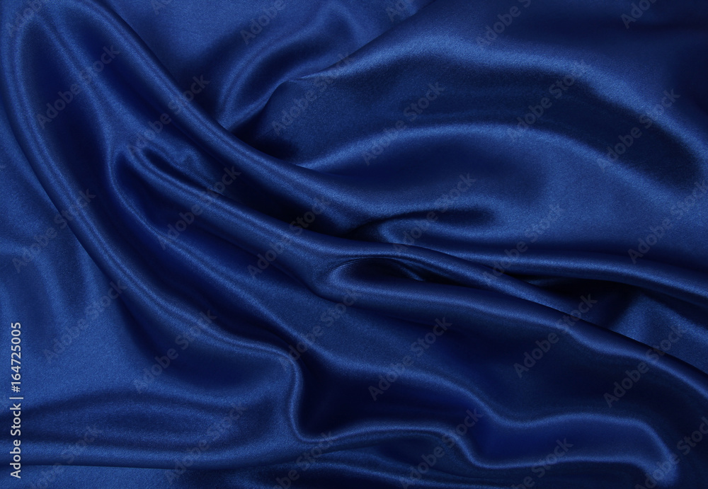 Fototapeta premium Smooth elegant blue silk or satin luxury cloth texture as abstract background. Luxurious background design