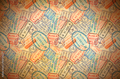 Colorful International travel visa rubber stamps imprints on old paper, horizontal vintage background