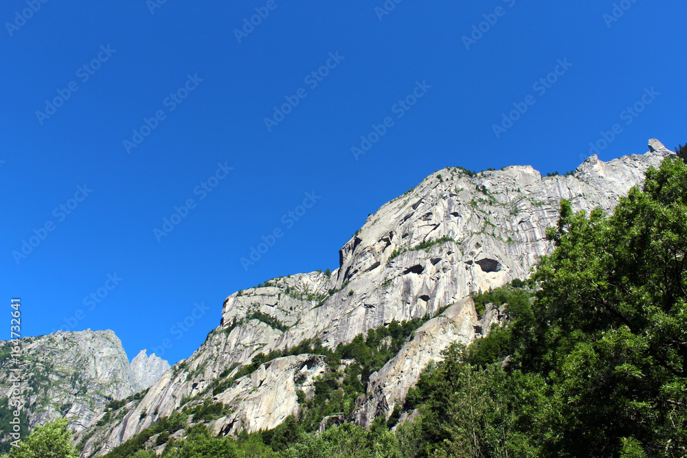 Granite rocks mountain walls in an alpine valley (Val di Mello batholith)