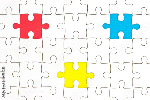 Jigsaw Puzzle with missing pieces in three different colors