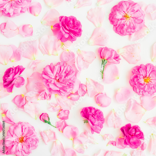 Floral pattern made of pink roses and petals on white background. Flat lay  top view