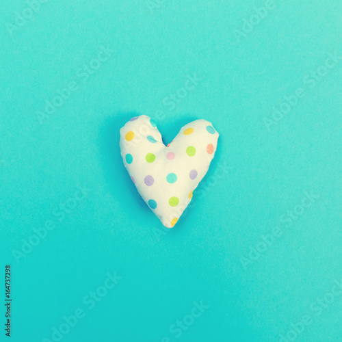 Handmade heart cushions on a blue background
