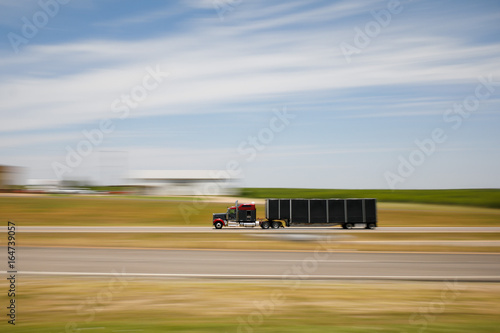 Truck travels through the desert photo