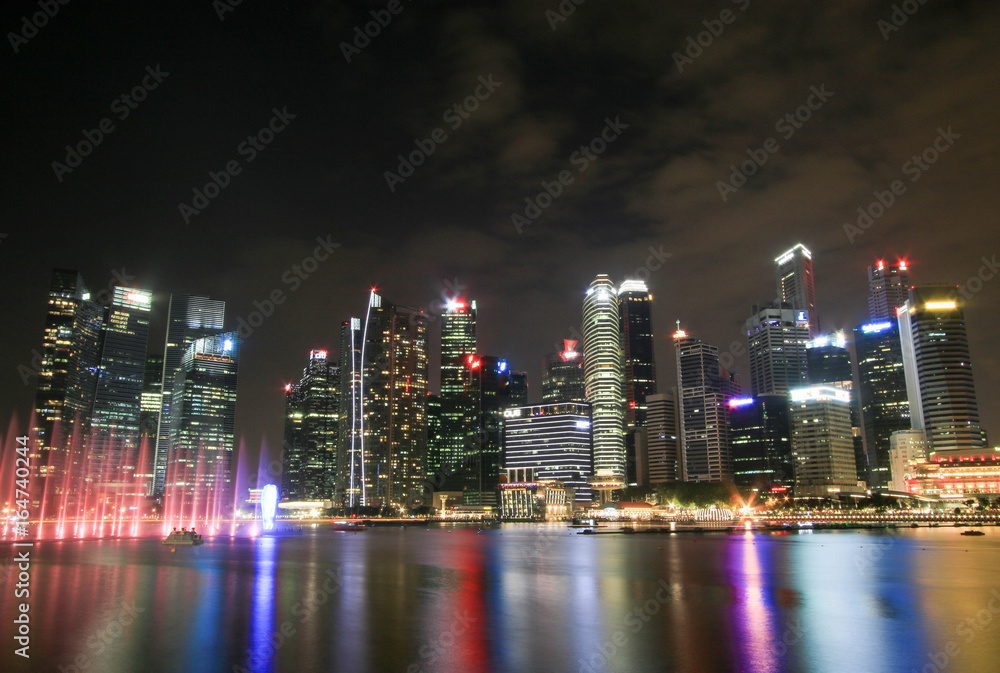 Singapore - JULY 8, 2017 : Singapore city skyline at night. Singapore - JULY 8, 2017 : Singapore city skyline at night.
