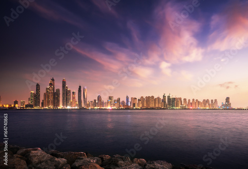 panorama of skyscrapers in Dubai Marina, sunset time, UAE