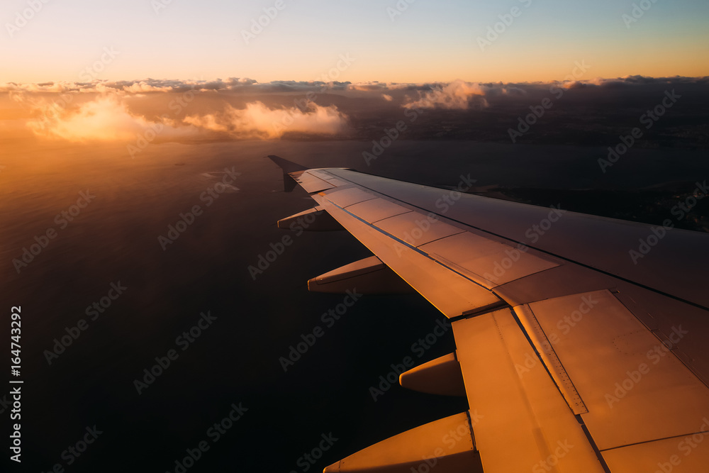 Sun shining from the corner of image on the aircraft wing with l Sun shining from the corner of image on the aircraft wing with l